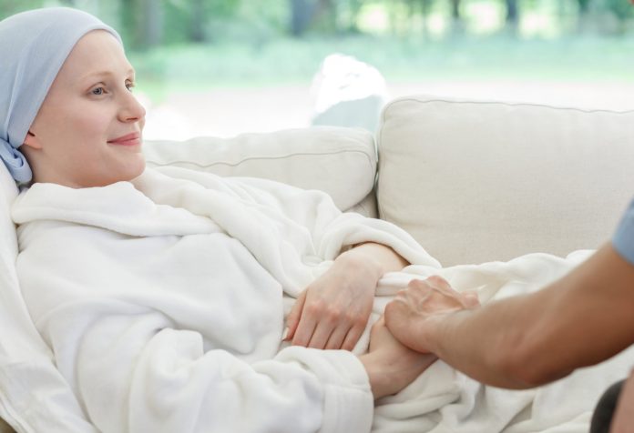 Nurse supporting woman battling cancer