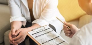 Blood-Based T-Cell Receptor Signatures as a Biomarker for Cancer Risk in Lynch Syndrome Doctor talking with a patient's health in medical clinic.