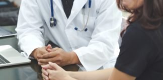 FDA Approves First Diagnostic Tests to Identify HER2-positive Metastatic Breast Cancer Patients Eligible for Trastuzumab Deruxtecan Doctor discussing treatment options with a patient.