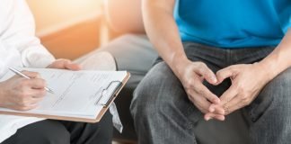 Colorectal Cancer and the Use of Non-invasive Screening Tools A patient having consultation with doctor or psychiatrist who working on diagnostic examination on men's health disease or mental illness in medical clinic or hospital mental health service center. Photo Courtesy: © 2019 - 2020 Fotolia/Adobe
