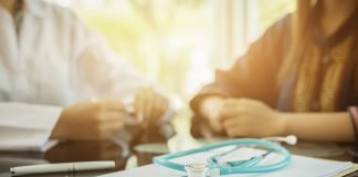 Final Medicare Rule Maintains Protections for Part D Beneficiaries with Cancer Doctor and Patient Discussing Treatment Options