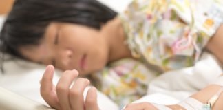 ASH 2025: Financial Toxicity and Cancer – One-Third of Families with Children Being Treated for Leukemia Struggle to Pay Living Expenses Child patient with IV line in hand sleep on hospital bed