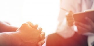 Appendix Cancer Rising Among Younger Generation – New Study Physician consulting with a patients in hospital exam room.