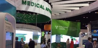 Biologics License Application and Priority Review for Enfortumab Vedotin in Urothelial Cancer Seattle Genetics. Exhibition booth during the 2019 annual meeting of the American Society of Medical Oncology (ASCO). In the back of the booth the enfortumab vedotin presentation.