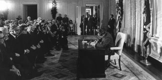 War on Cancer at 50: The Origin Story Begins With a Socialite Citizen-Lobbyist The Signing the National Cancer Act. President Richard Nixon signs the National Cancer Act on December 23, 1971. This is a formal setting with a row of senators visible and some other officials and dignitaries. Courtesy: National Cancer Institute, an agency part of the National Institutes of Health (ID 1935) / Linda Bartlett